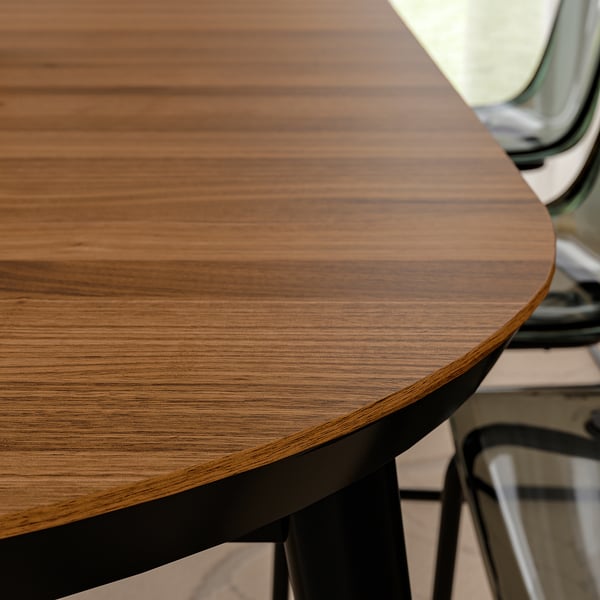 Close-up of a stylish, durable wooden table with a smooth, lacquered finish showcasing its natural wood grain.
