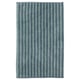 A TOFTBO bath mat in blue, rectangular, with a textured, plush surface. Made from recycled polyester.