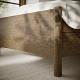 Close-up of well-crafted wooden bed frame showing sturdy design and fine grain texture.