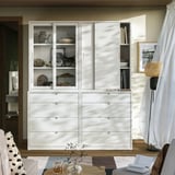White TONSTAD furniture set with glass doors and drawers, displaying decorative items. Soft-close drawers, clean lines.