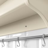 Chrome towel bar with s-hooks on bathroom wall.