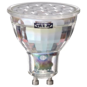 Ikea TRÅDFRI led smart light bulb, clear, round shape with metallic base.
