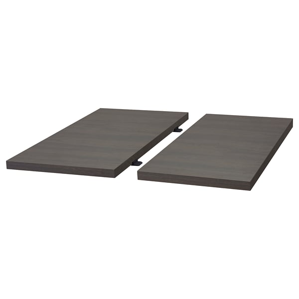 A black TRANEBO dining table with metal legs and a dark, rectangular top, designed for modern dining spaces.
