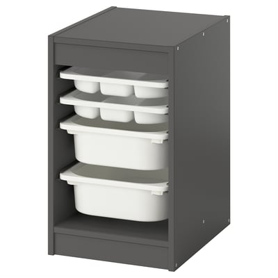 A TROFAST storage unit in grey, containing stackable white plastic boxes and trays.