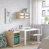 Kids room with TROFAST units, art supplies, desk, chair, cloud wallpaper, large window.