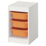 White TROFAST storage with 3 orange bins, open shelving for kids.