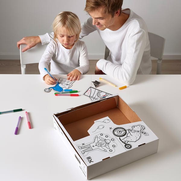 Man and child crafting with TROLLBO, a recycling box with circus tent design that becomes a lamp.