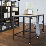 The TROTTEN, beige, rectangular meeting table on wheels, includes laptop, bottle, and hooks.