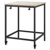 A TROTTEN beige desk on casters with a black metal frame.