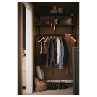 Displays a TURBO black metal clothing rack with a minimalist design, featuring a sturdy a-frame base and castors for easy movement.