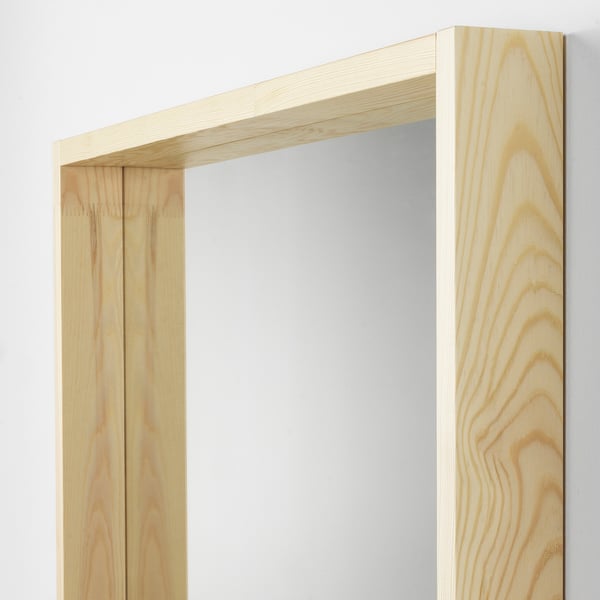 Mirror with a sturdy wooden frame, natural finish. Reputation for durability and classic design, ensuring quality.