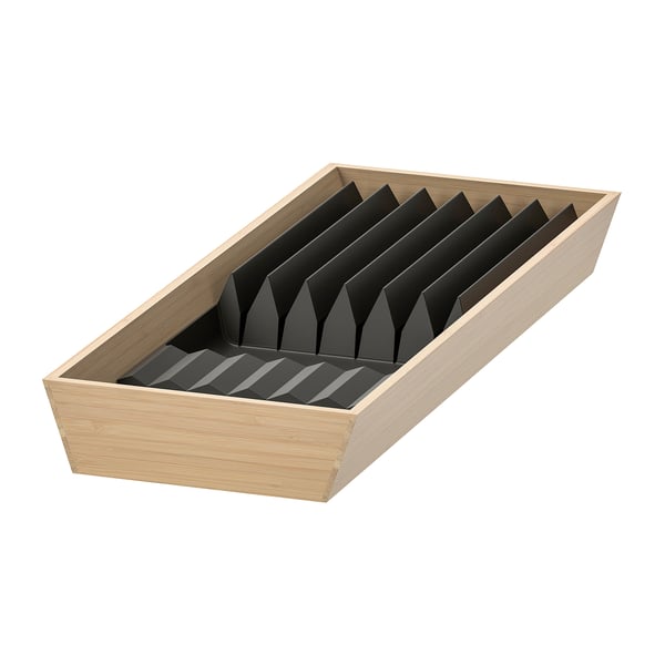 A wooden drawer organizer with black partitions for knives and utensils.