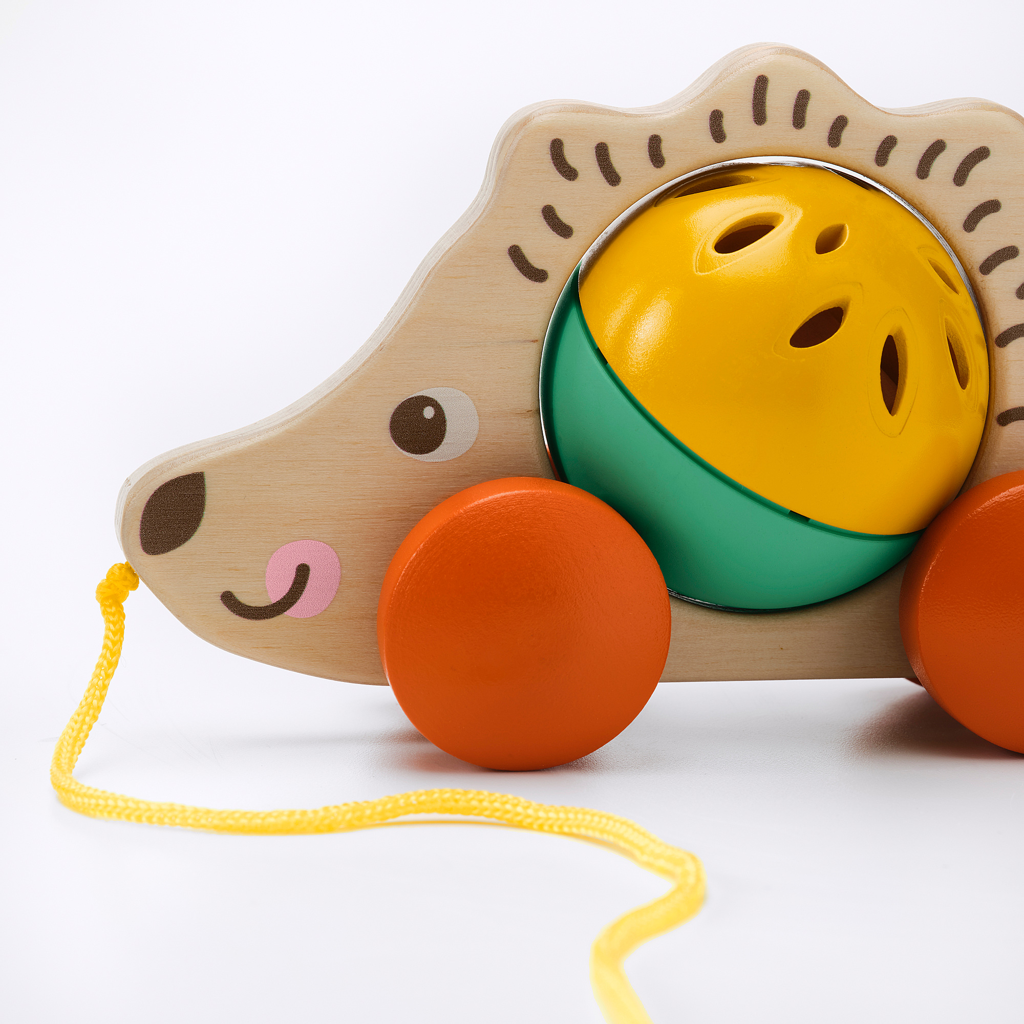 Cute wooden hedgehog toy with bright wheels and yellow string, designed for childrens play.