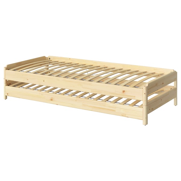 An ikea UTÅKER light wood twin bed frame. The frame is rectangular, made of light-colored pine wood, and horizontal slats for support.