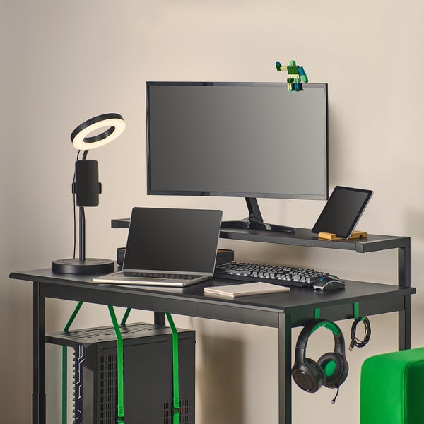 Gaming desk with adjustable height, monitor shelf, keyboard storage, and cable management. Includes headphone hooks and cpu tower straps.