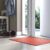 Orange & white striped door mat near entrance.