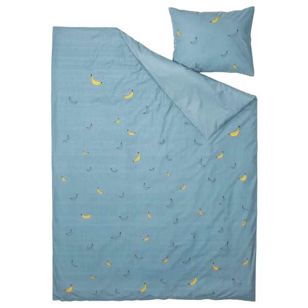 A blue VÄNKRETS duvet cover and pillowcase with yellow banana prints, made from cotton and viscose.
