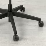 Close-up of durable office chair base and castors.