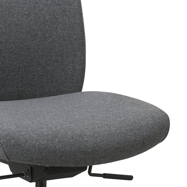 Close-up of ergonomic VALLFJÄLLET office chair, showing plush, dark grey fabric seat and backrest. High-quality density foam for comfort.