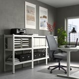 Home office with VALLFJÄLLET chair, desk, & storage. Chair tucked under, storage tall with shelves & decor.