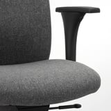 Modern office chair with adjustable armrests, upholstered in gray fabric. Armrests feature padded support for comfort.