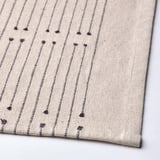 Cotton & jute table runner with subtle stripes and tassels.