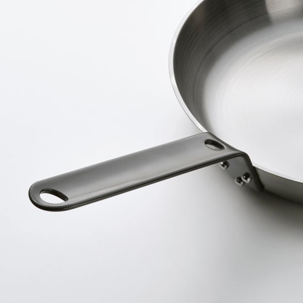 Stainless steel skillet with robust handle and hanging hole, smooth and easy to clean.