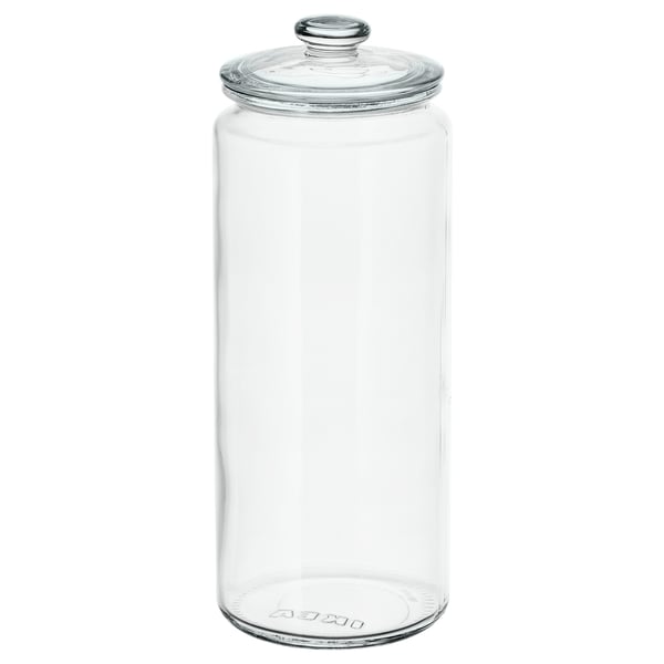 Clear glass storage jar, cylindrical shape, with lid, no contents, someone might store cookies or other items inside.