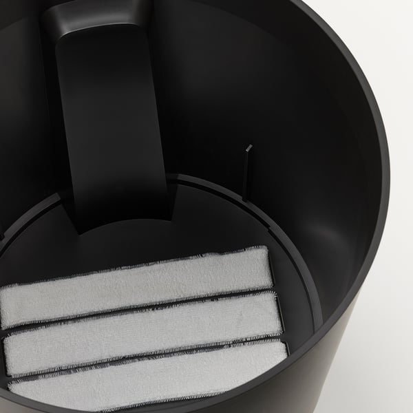 Self-watering planter with filter, large opening, wheels, water level indicator.