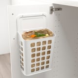 White wall-mounted waste bin with lid and ventilation. Designed for kitchen use, suitable for sorting waste.