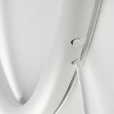 Close-up of modern white wall lamps switch, showcasing sleek design and quality materials.