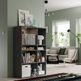 Gray VIHALS storage unit in living room with mixed storage and cable management.