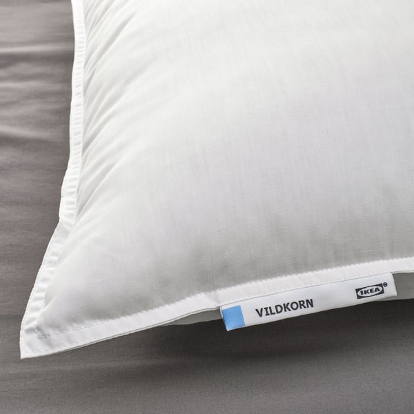 VILDKORN pillow by ikea on bed, soft-firm, recycled, machine washable.