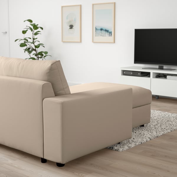 Beige VIMLE sofa with chaise in minimalist living room, tv on console.
