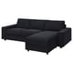 Black l-shaped sofa with sectional chaise, modern design, dark grey upholstery, clean lines, supportive cushions.
