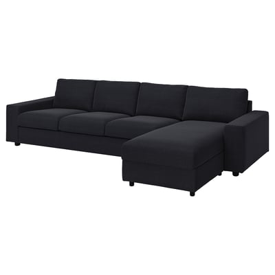 A black VIMLE modular sofa with a chaise lounge. It a modern, minimalist design with square cushions and clean lines.
