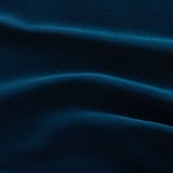 Deep blue velvet fabric close-up, smooth with slight sheen, depicts luxurious texture and quality.