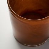 Cylindrical glass vase with swirling amber pattern, showcasing high-quality, mouth-blown craftsmanship.
