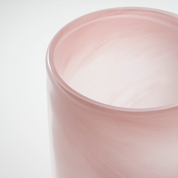 Pink glass candle holder, smooth edges, handcrafted quality, gently glowing.