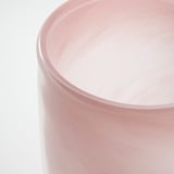Light pink candle holder with smooth, glossy finish, reflective surface.