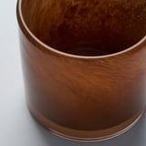 Handcrafted glass candle holder with polished finish.