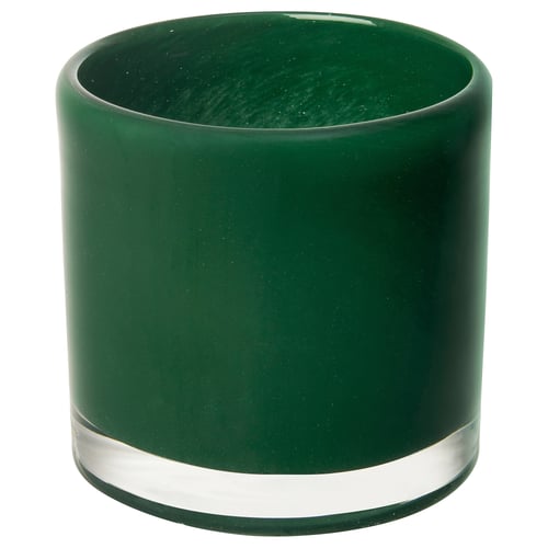 Green glass candle holder, rounded shape, partly frosted.