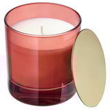VINTERFINT candle: red glass, gold lid, rounded shape. Emits orange and cloves scent.