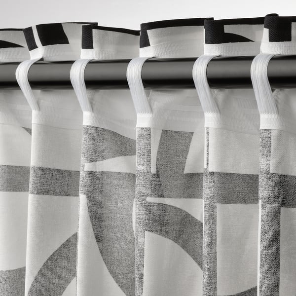 Vintage curtains with geometric pattern, sheer, tabs, light control.