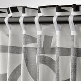 Vintage curtains with geometric pattern, sheer, tabs, light control.