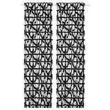 Black and white patterned curtains with abstract shapes, hanging straight. Modern and stylish design, made of cotton.