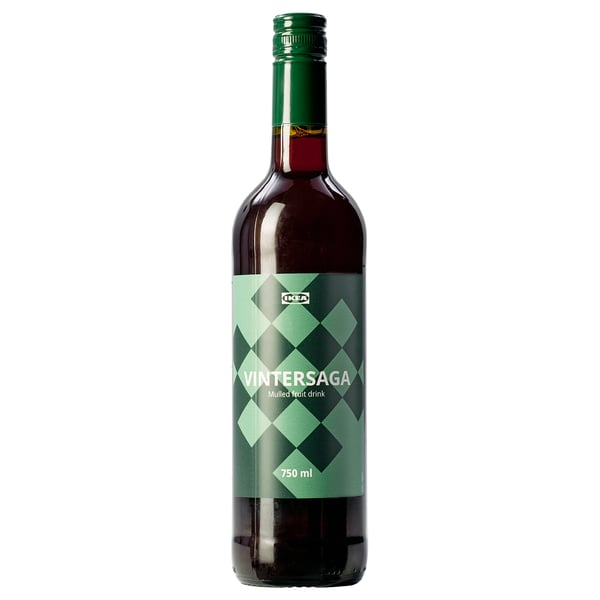 Green glass bottle of VINTERSAGA mulled fruit drink with diamond pattern label, standing upright.