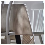 A beige and brown striped tablecloth made of cotton, elegantly draped over a table.
