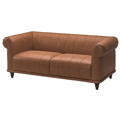 VISKAFORS orange leather sofa with rolled arms and wooden legs.