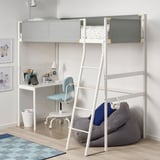 A compact white VITVAL loft bed with a ladder and desk beneath. Grey fabric and a tidy design make it space-efficient.